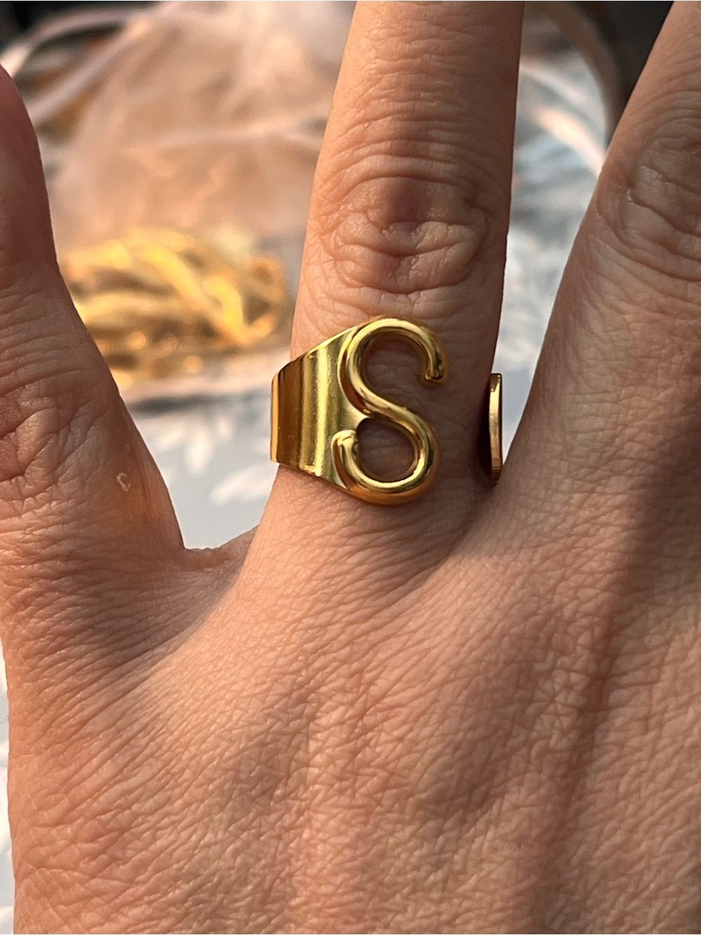 Plunder Gold tone  S open wrap ring.